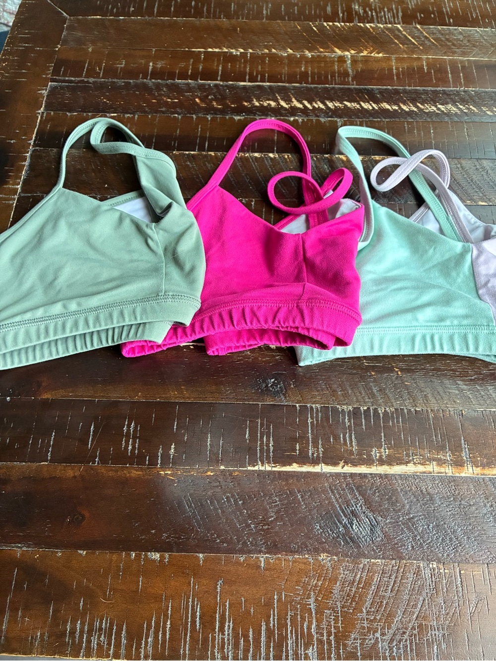 Fleo Sports Bras in pink, light green and mixed colors.